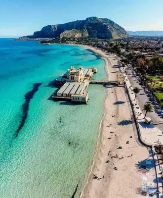an aerial view of a beach with a boat in the water at Lilla' House Center Palermo in Palermo
