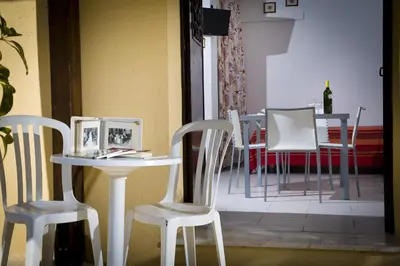 a table and two chairs and a table and chairs at Casa Vacanza Saraceno in Castellammare del Golfo