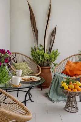 a room with two chairs and a table with food on it at Casa Lucale in Palermo