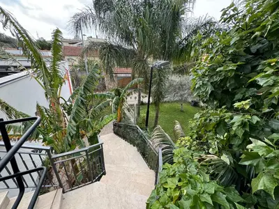 a stairway in a garden with trees and plants at Casa Lucale in Palermo