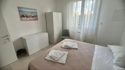 a bedroom with a bed with two towels on it at La Casa di Elisa Mini Apartment - Palermo in Palermo