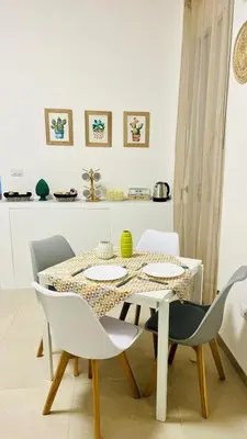 a dining room with a table and chairs at La Casa di Elisa Mini Apartment - Palermo in Palermo