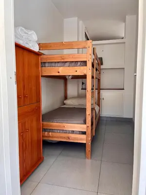 a bunk bed in a room with a bunk bed in a room at Flat with Terrace & Pool in Mondello