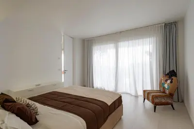 a bathroom with a shower with a wooden wall at Addaura Home in Palermo