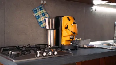 a kitchen counter with a yellow mixer on top of a stove at Appartamento in Centro Storico a Termini Imerese - Eden Holiday Home in Termini Imerese