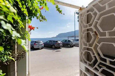 a view of a parking lot with cars parked at Villa Emilia Mondello Appartamento Emily con vista sul mare in Palermo