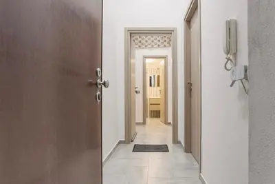 a hallway with a door leading into a room at Case Billeci Casa Verde in Palermo