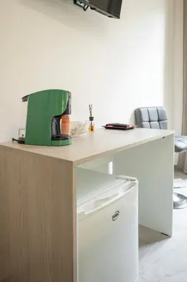 a coffee maker sitting on top of a desk at Case Billeci Casa Verde in Palermo