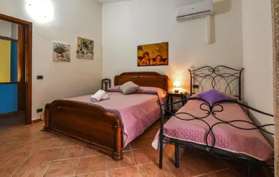 a bedroom with two beds in a room at 4 Bedroom Stunning Home In Trappeto in Trappeto