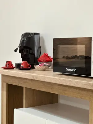 a microwave sitting on a counter next to a toaster at Casa Andrew in Terrasini