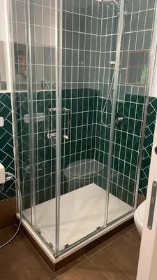 a shower in a bathroom with green tile at Appartamenti Franco il Conte in Bagheria