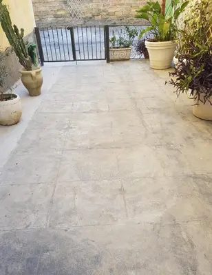 an empty patio with potted plants in a building at SUITE AND RELAX TINA a 2 passi dal centro e al foro italico in Palermo
