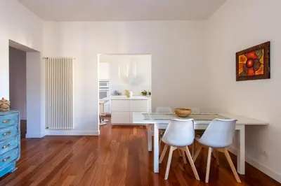 a kitchen and dining room with a table and chairs at Casa Madà vicino al Politeama by Wonderful Italy in Palermo