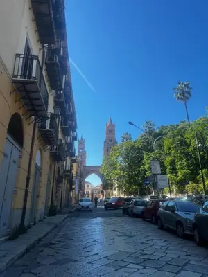 a cobblestone street with a bridge in the background at Maqueda Vibes in Palermo