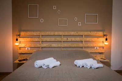 a bedroom with a bed with two towels on it at Casa vacanza la finestra sul porto in Castellammare del Golfo