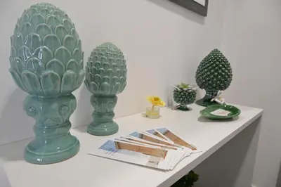 a shelf with three green vases on it at Da 'Nfacci Affittacamere in Carini