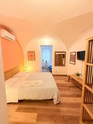 a bedroom with a large bed in a room at Due Sicilie Ballarò in Palermo