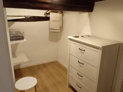 a room with a white dresser and a shelf at IGIEA APARTMENT in Palermo