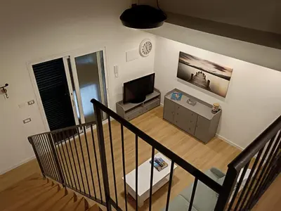 an overhead view of a living room with a television at IGIEA APARTMENT in Palermo
