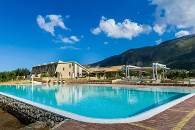 a large swimming pool in front of a building at Borgo Aranci - Villa Unifamiliare Ibiscus 08 in Castellammare del Golfo