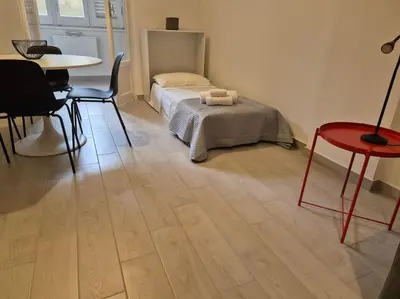 a bedroom with a bed with towels on it at MaGi Mondello in Mondello