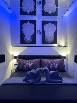 a bedroom with a bed with two towels on it at Holiday home Joy in Palermo