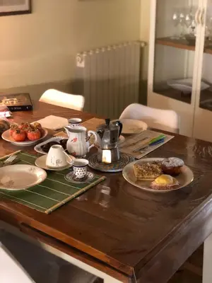 a wooden table with plates of food on it at We # Are ai Cassarelli in Palermo