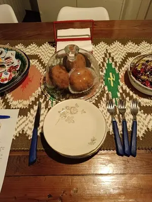 a table with a plate of food on a table at We # Are ai Cassarelli in Palermo