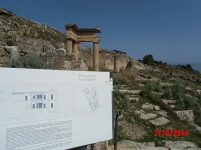 a sign in front of a building on a hill at Holiday home Santa Flavia in Santa Flavia