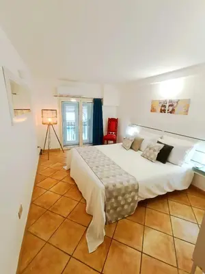 a living room with a couch and a tv and a table at Quattro Canti - residenza Santa Caterina in Palermo