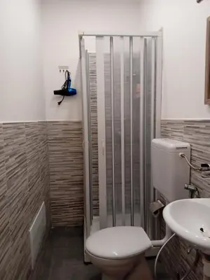 a bathroom with a toilet and a sink at BBX Palermo 2 in Palermo