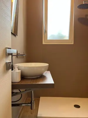 a bathroom with a white bowl sink on a counter at Villa Francesca in Carini
