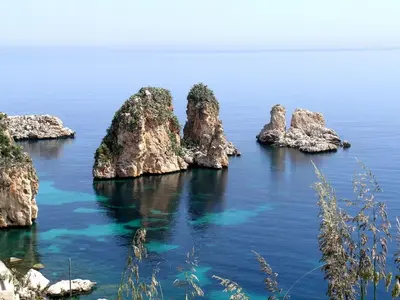 a group of rocks in the water at VILLa CON PISCINA SCOPELLO in Castellammare del Golfo
