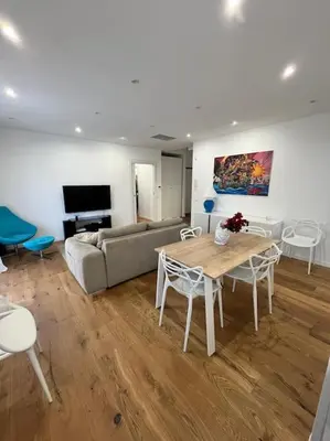a living room with a couch and a table and chairs at Lazio apartment nel centro di Palermo in Palermo