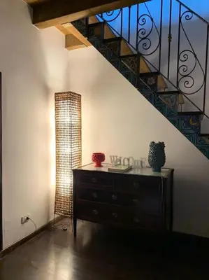 a room with a dresser and a staircase at Casa Bosco a Ballarò in Palermo