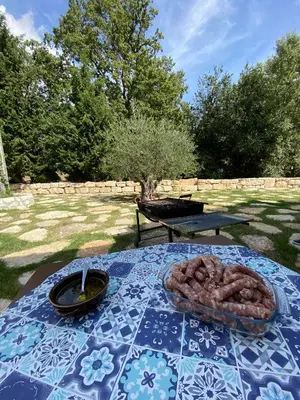 a picnic table with a plate of food on it at Fattoria F.lli Marsolo in Chiusa Sclafani