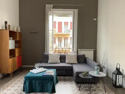 a living room with a couch and a table at Victoria's Apartment in Palermo