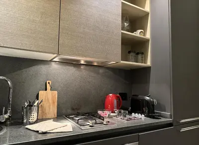 a kitchen counter top with a stove top oven at Victoria's Apartment in Palermo