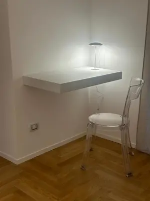 a white counter with a chair under a shelf at Lily Suite in Palermo