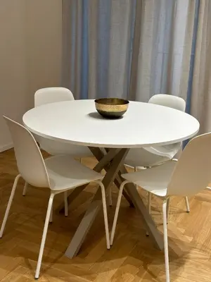 a white table and chairs with a bowl on top at Lily Suite in Palermo