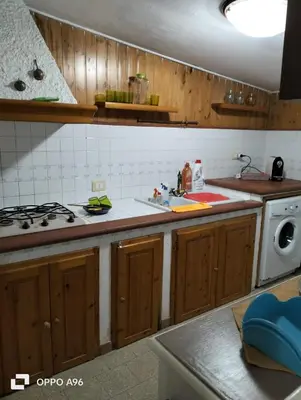 a kitchen with a sink and a stove top oven at LA TERRAZZA SUL MARE monolocale con terrazza vicino aereoporto&mare SICILIAN VINTAGE STYLE BEACH HOUSE in Cinisi