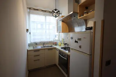 a kitchen with a white refrigerator and a sink at Politeama Holiday Home - La tua casa nel cuore di Palermo! in Palermo