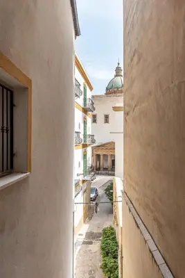 a view from an alley between two buildings at Casa Brunaccini con Terrazza by Wonderful Italy in Palermo
