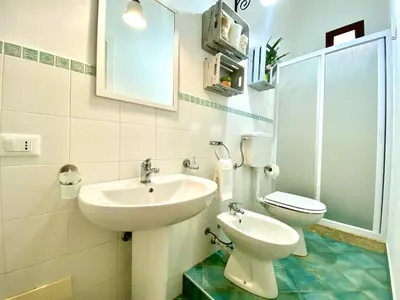 a bathroom with a sink and a toilet at Le Case di Anan, Castellammare del Golfo in Castellammare del Golfo