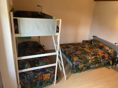 a bedroom with two bunk beds and a bed at Orto Raccolto in Termini Imerese