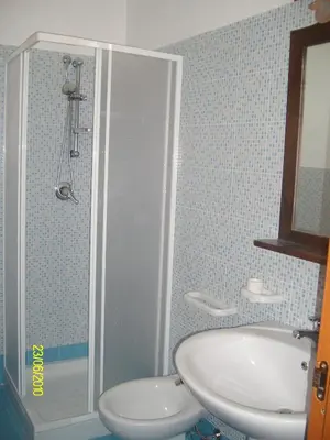 a bathroom with a sink and a shower at casa cocos in San Vito lo Capo