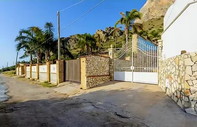 a gate to a house with a fence at Villa Antonio in Cinisi
