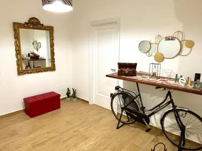 a bike parked in a room with a mirror at Da Zia Maria in Palermo
