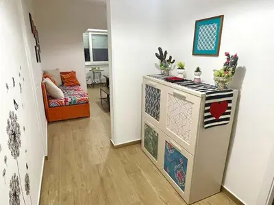 a living room with a refrigerator and a couch at Da Zia Maria in Palermo