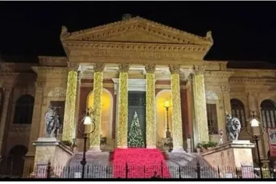 a building with a christmas tree in front of it at Da Zia Maria in Palermo